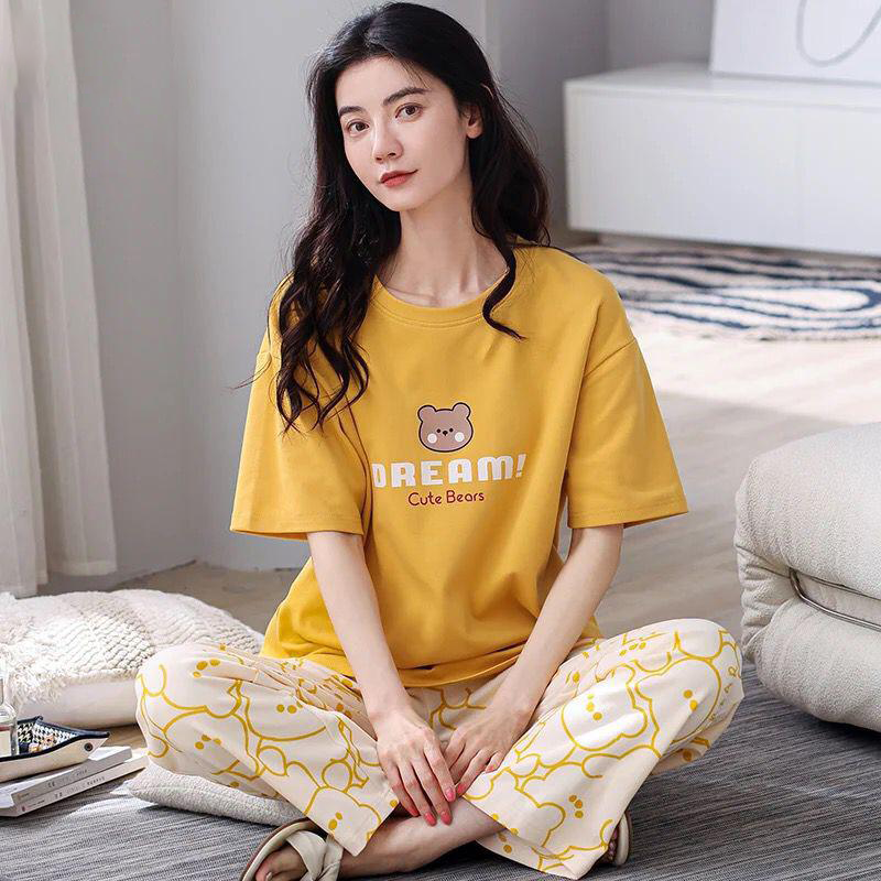 Woman wearing cute bear printed cotton night dress soft comfortable sleepwear for home and bedtime