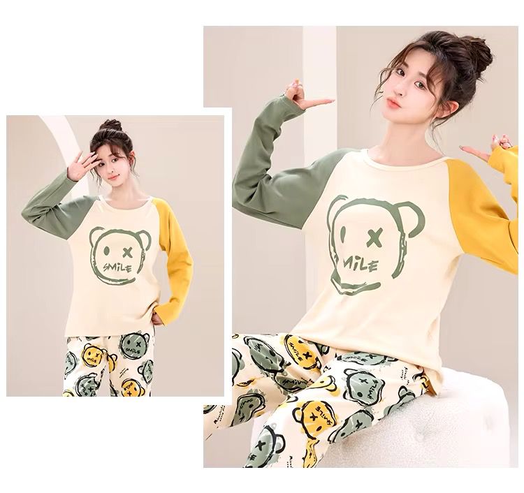 Woman wearing multi smile bear printed cotton jersey night dress with cute graphic top and matching pajama bottoms
