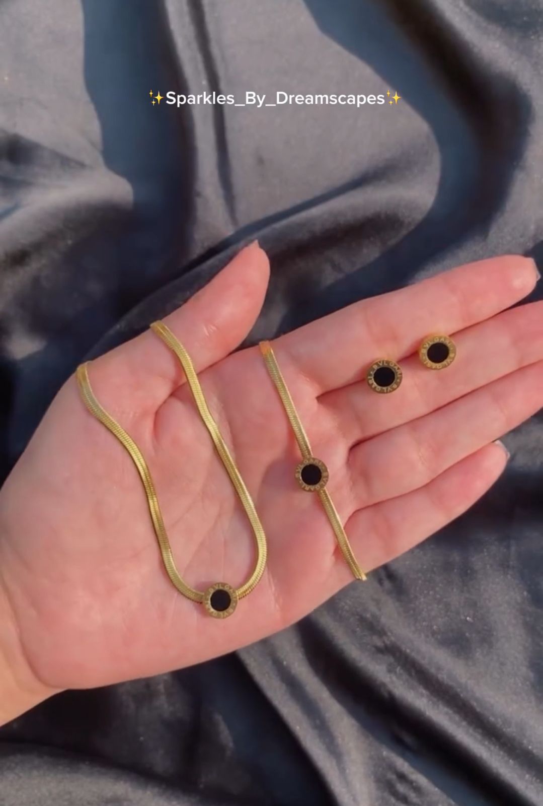 Luxury stainless steel black circle jewelry set with gold snake chain necklace, matching bracelet and round stud earrings for women